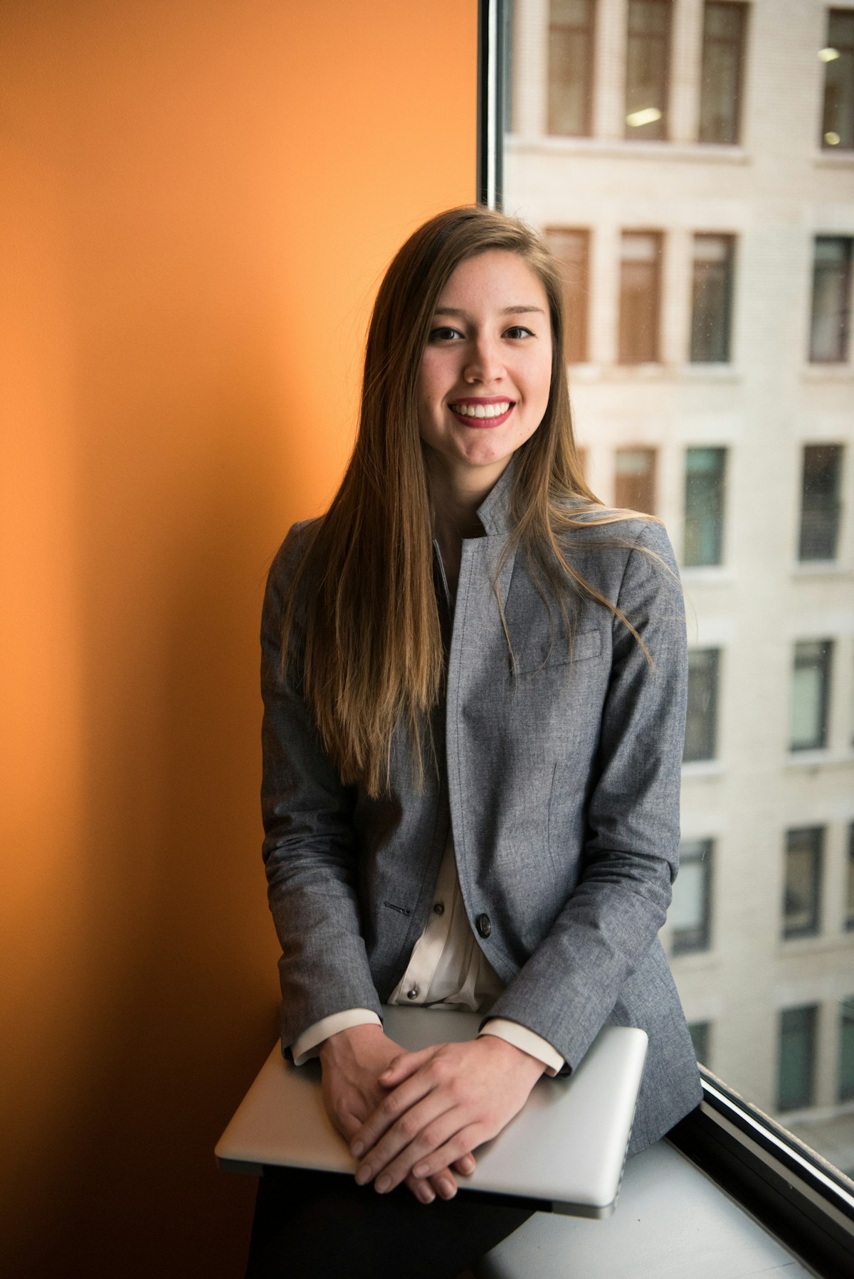 Kristi McBee, businesswoman and president of Lan-Tel Communications, seated in a modern executive office reviewing infrastructure development and corporate strategy