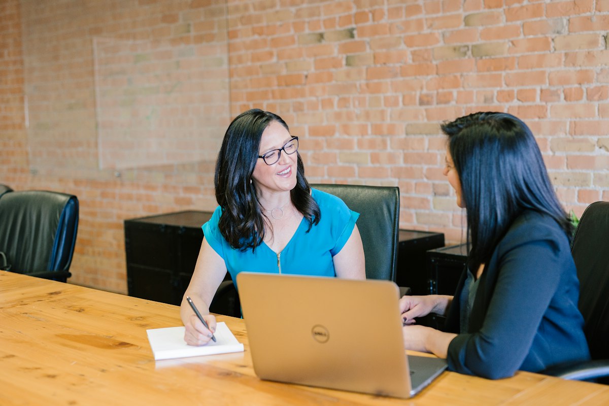 Digital content investigator reviewing author archives, verification documentation, and professional registry records