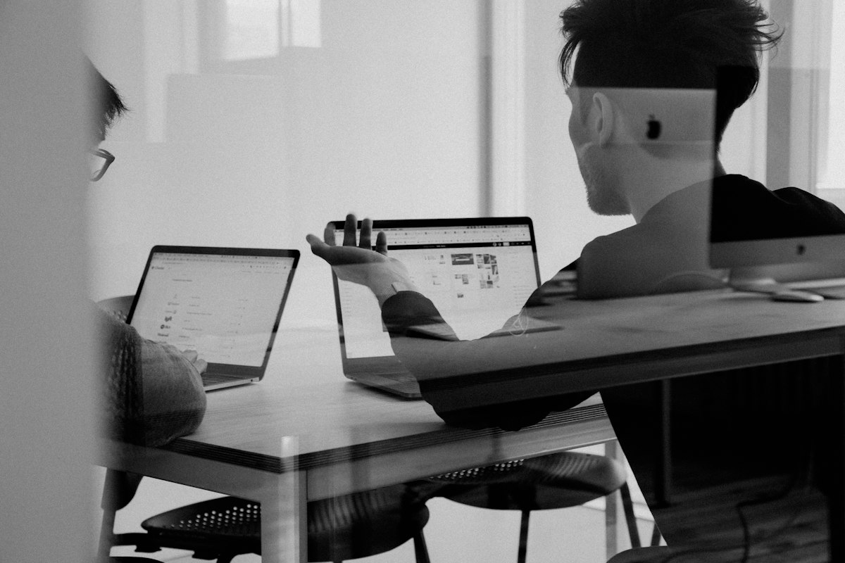 Multi-topic publishing strategy session showing digital business consultation, category structuring, and content planning on tablet